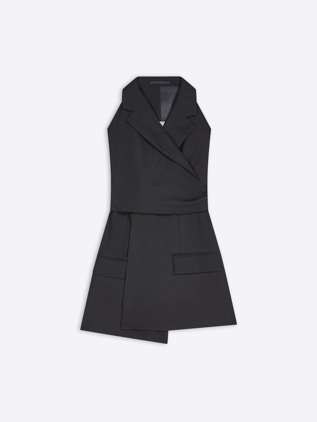 A black sleeveless wrap-style blazer top with a structured collar, asymmetrical front, and flap pockets, shown on a light gray background.