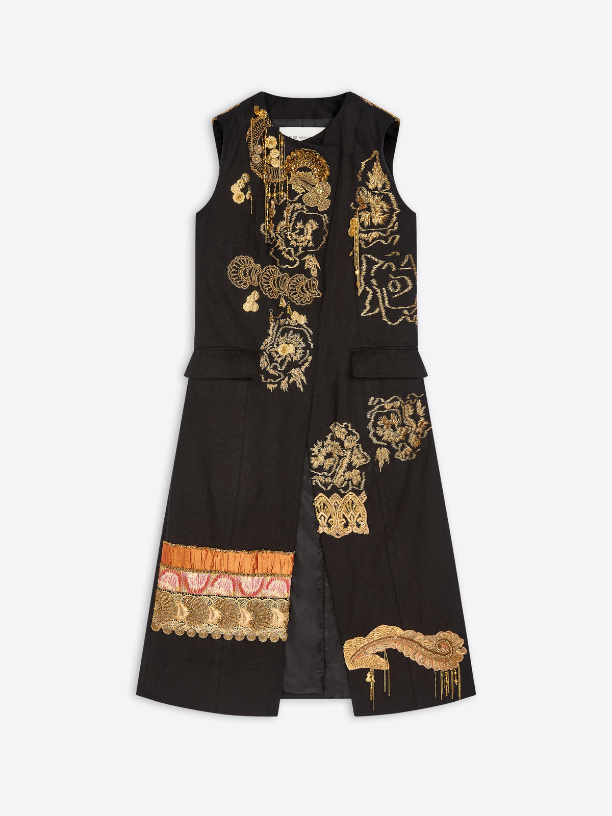 A sleeveless black long coat with ornate gold embroidery, featuring a draped front, decorative gold floral and scroll motifs, and a multicolor patterned band near the lower left hem, displayed against a light gray background.