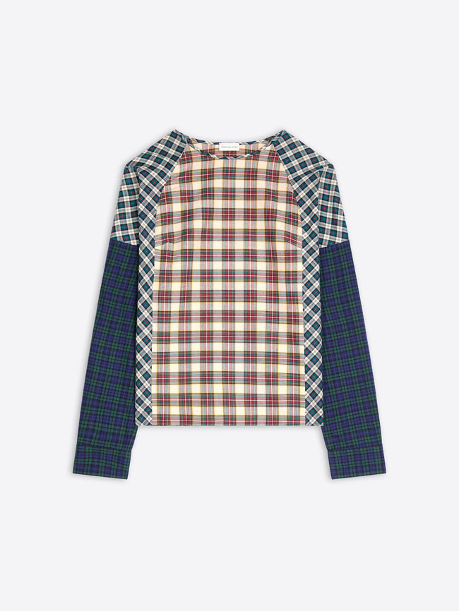 A long-sleeve raglan top with a multi-colored plaid pattern, featuring a cream and red checkered center body, green and white checkered shoulder yokes, and solid dark green plaid sleeves, shown flat on a light gray background.