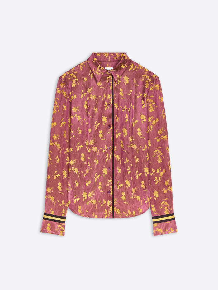 A long-sleeve button-up shirt in a dusty rose pink color with a yellow floral pattern, featuring yellow stripes on the cuffs.