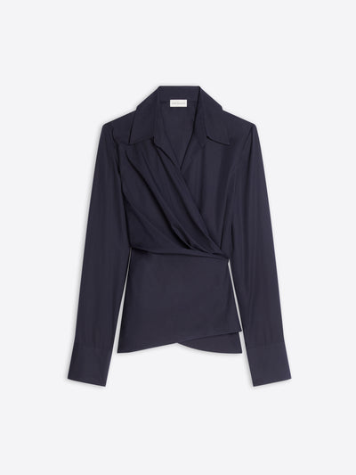 A dark navy wrap-style blazer top with long sleeves, a structured collar, and a draped asymmetrical front, shown on a light gray background.