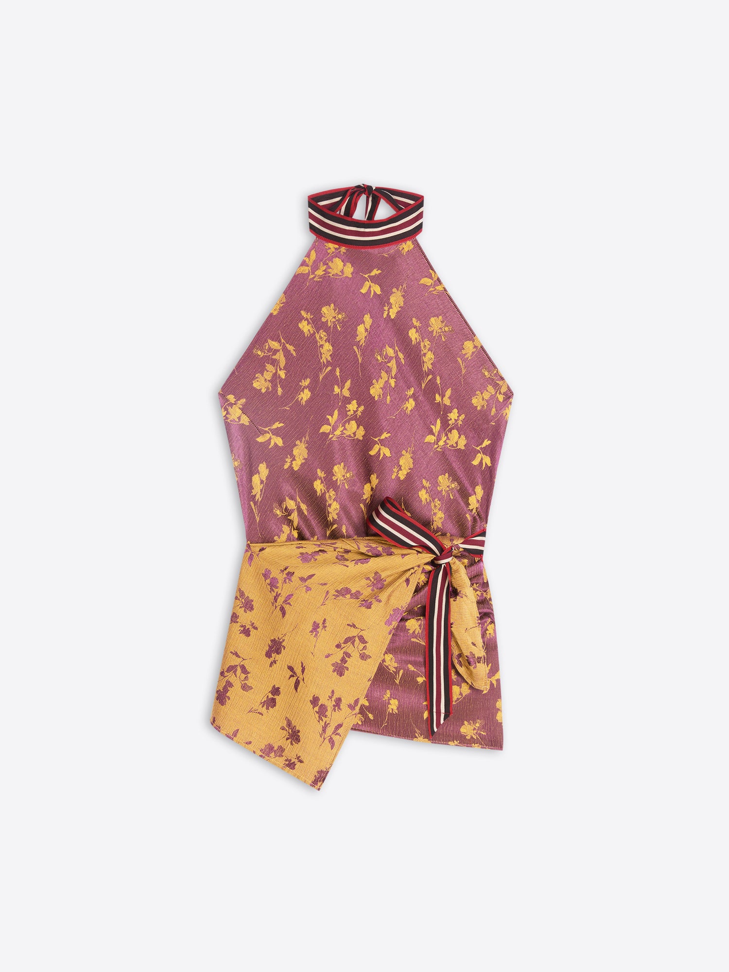 A sleeveless halter-neck top tied at the waist, featuring a dusty rose and mustard yellow floral print, set against a plain light gray background.