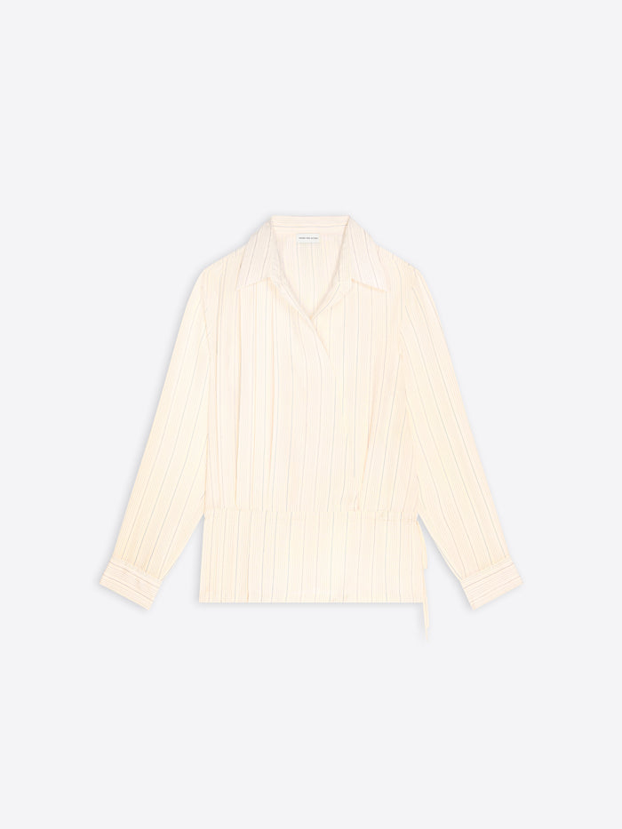 A cream-colored long-sleeve wrap shirt with vertical pleats, shown flat against a light gray background.