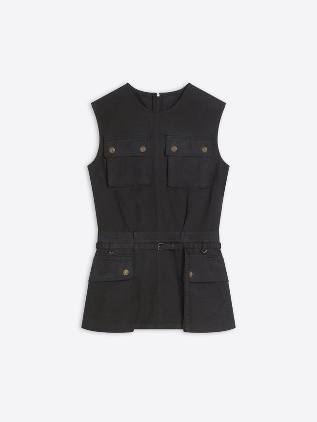 A black sleeveless utility-style top with a self-tie belt, featuring four front flap pockets with brass-tone buttons, displayed on a light gray background.