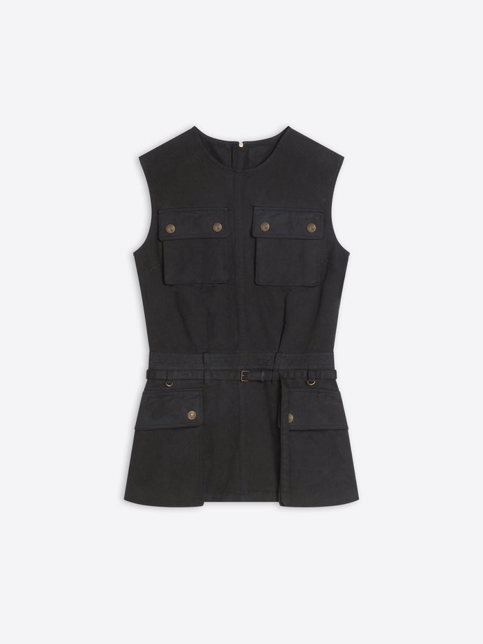A black sleeveless utility-style top with a self-tie belt, featuring four front flap pockets with brass-tone buttons, displayed on a light gray background.