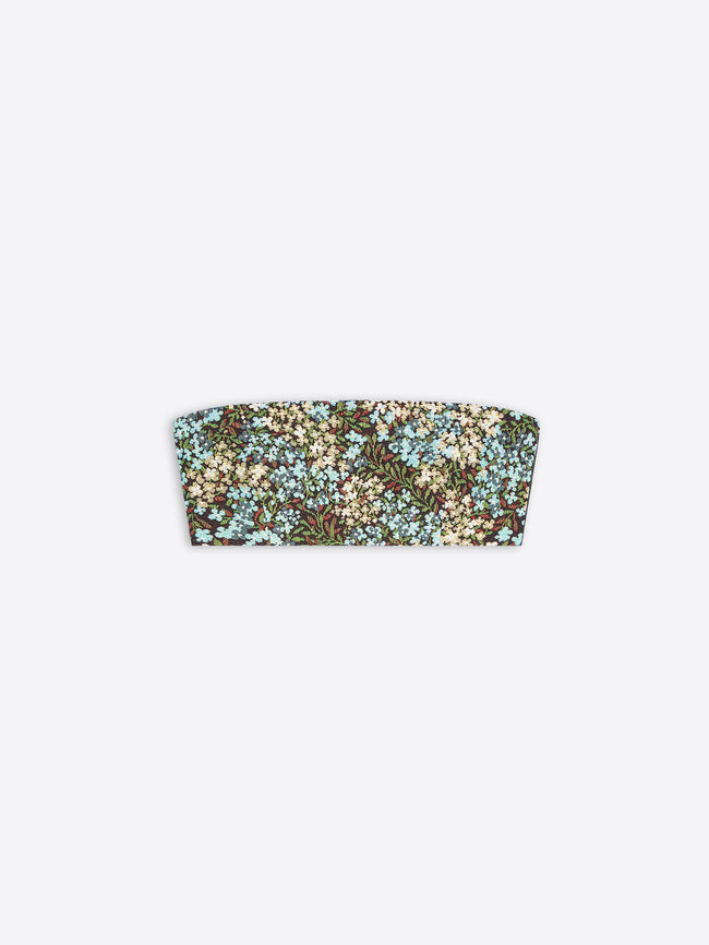 A strapless bandeau-style top featuring an all-over dense floral print in light blue, cream, green, and brown tones, shown flat against a light gray background.