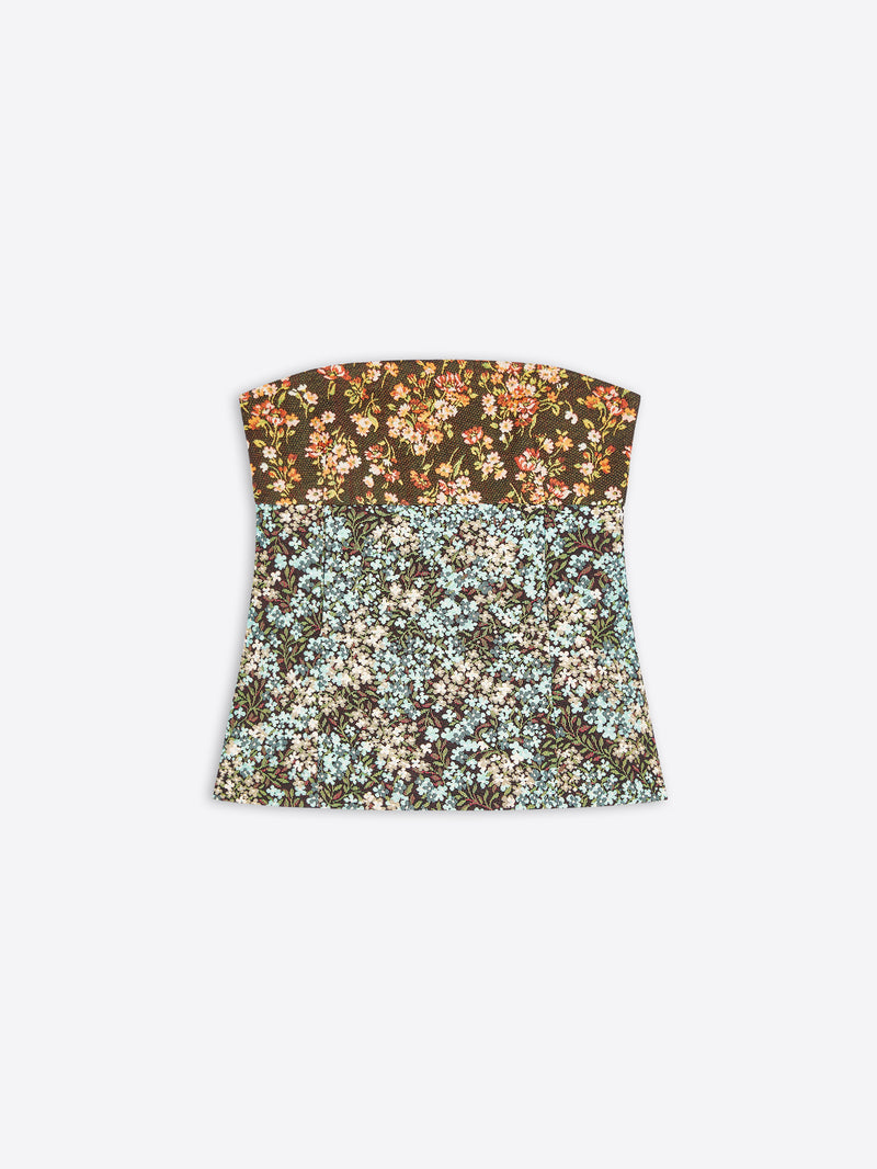 A strapless bandeau top with a split floral pattern, featuring a dark brown top half with orange and cream flowers, and a light blue and cream bottom half, shown on a light gray background.