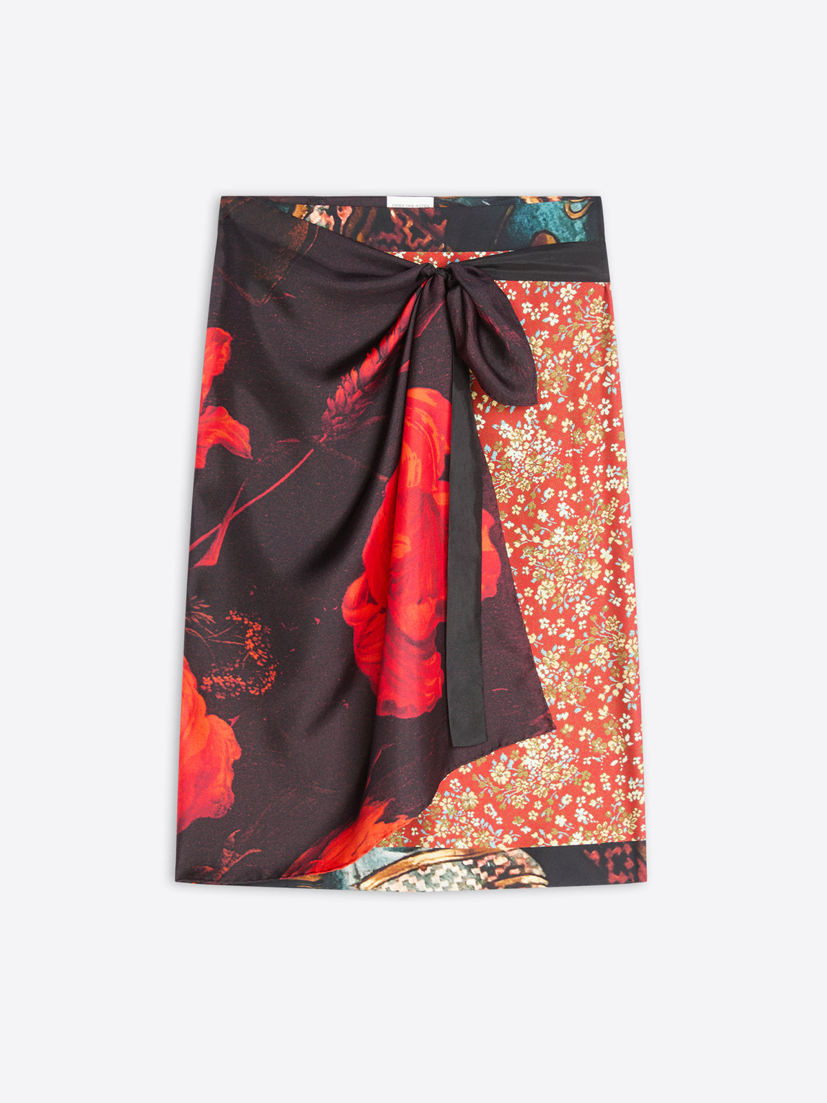 A wrap-style skirt with a tie waist, featuring a black base with large red floral motifs on one side and a red-orange field with small gold floral details on the other, shown flat against a light gray background.