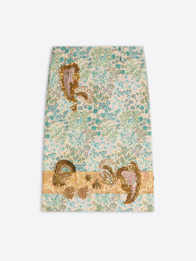 A skirt, featuring a dense floral pattern in shades of teal, green, and cream, accented with metallic gold and pink paisley motifs.
