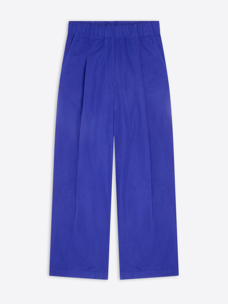 A pair of wide-leg trousers in a vibrant royal blue color, shown flat against a light gray background.