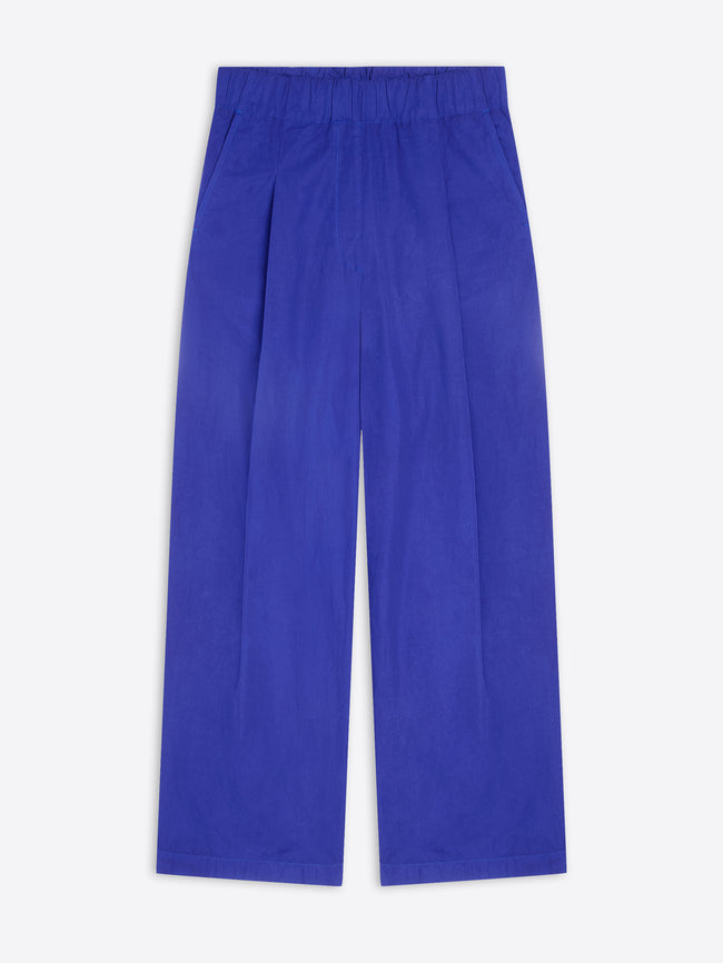 A pair of wide-leg trousers in a vibrant royal blue color, shown flat against a light gray background.
