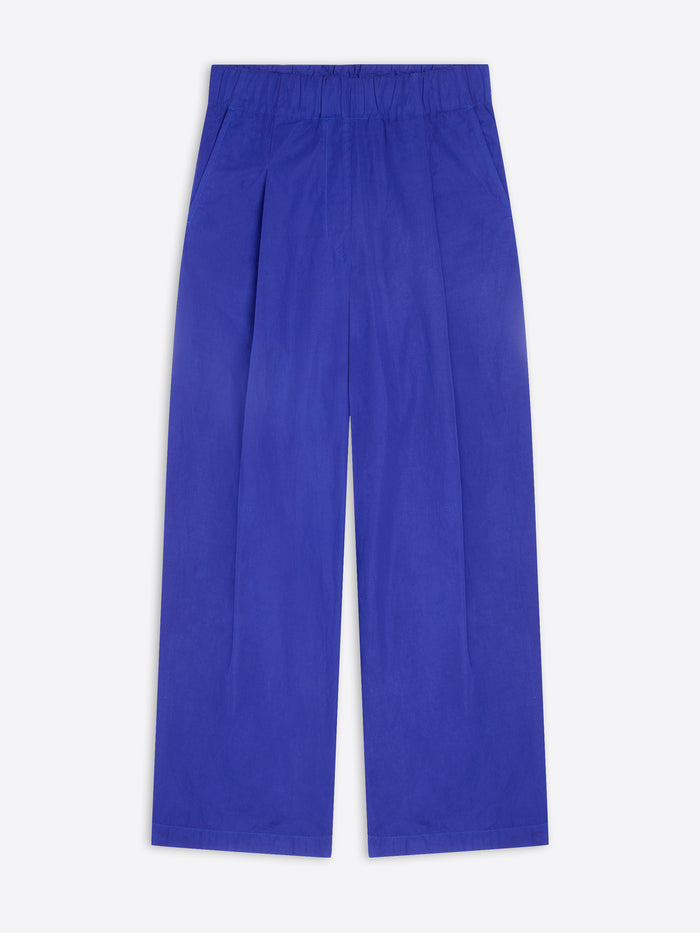 A pair of wide-leg trousers in a vibrant royal blue color, shown flat against a light gray background.