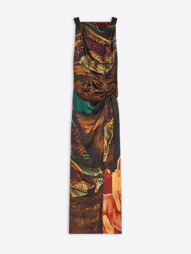 A sleeveless maxi dress with a draped, gathered silhouette, featuring an abstract, painterly print, shown against a plain light gray background.