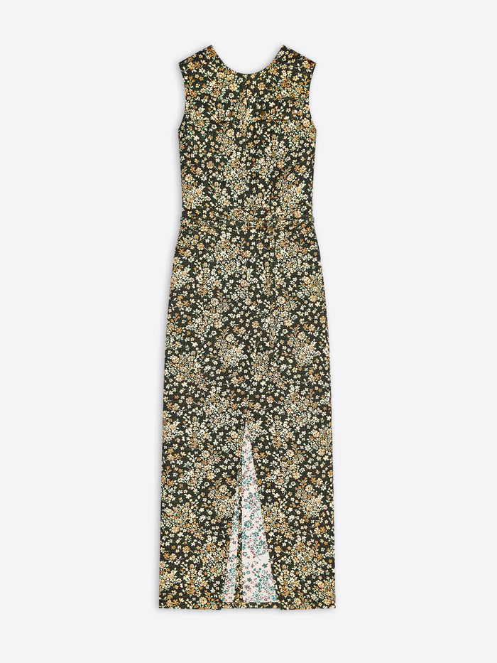 A sleeveless midi dress with a dense floral print in olive green, beige, and cream, featuring a high front slit.