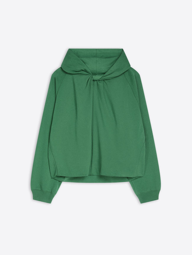 A green long-sleeve cropped hoodie with a draped, oversized front and a knotted tie detail at the neckline, shown against a light gray background.