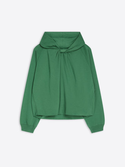 A green long-sleeve cropped hoodie with a draped, oversized front and a knotted tie detail at the neckline, shown against a light gray background.