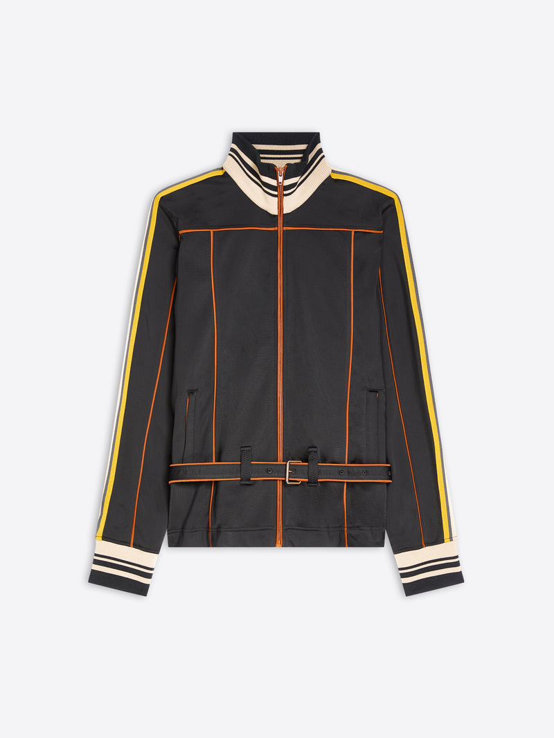 A black zip-up track jacket with cream and yellow stripe details on the shoulders, sleeves, and cuffs, and orange piping accents, shown against a light gray background.
