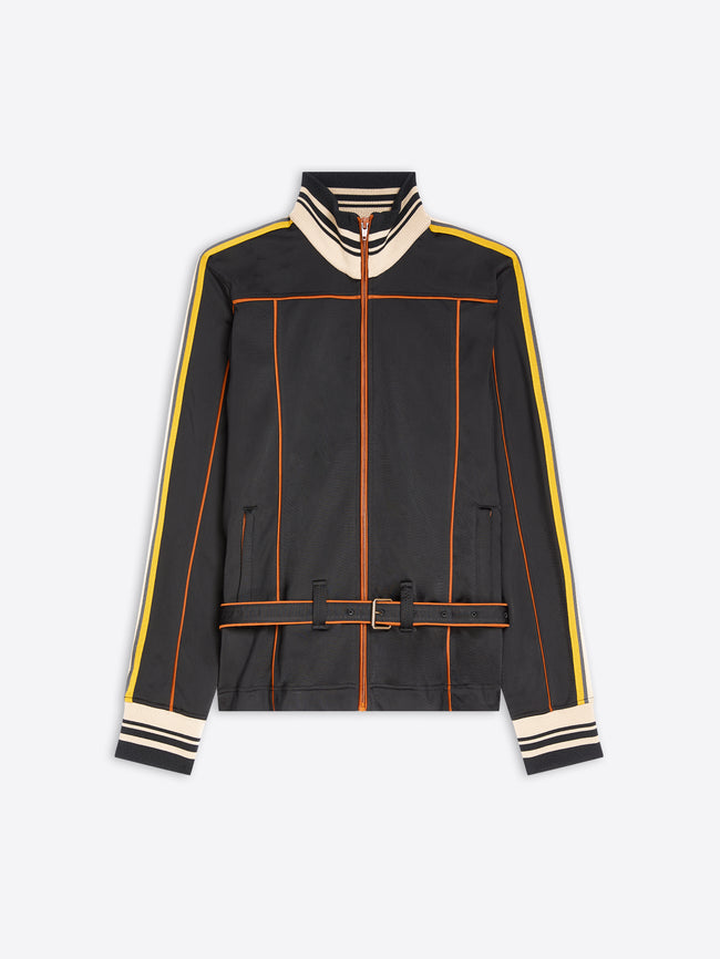 A black zip-up track jacket with cream and yellow stripe details on the shoulders, sleeves, and cuffs, and orange piping accents, shown against a light gray background.