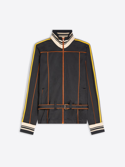 A black zip-up track jacket with cream and yellow stripe details on the shoulders, sleeves, and cuffs, and orange piping accents, shown against a light gray background.