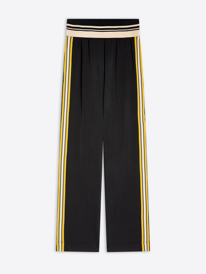 Black wide-leg cropped pants with double yellow and white side stripes and a beige and black striped waistband, shown flat on a light gray background.
