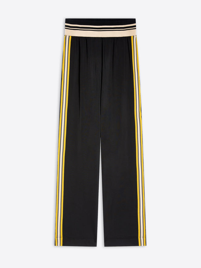 Black wide-leg cropped pants with double yellow and white side stripes and a beige and black striped waistband, shown flat on a light gray background.