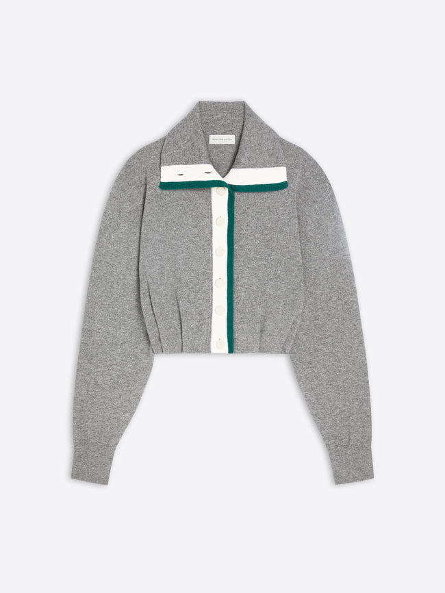 A cropped gray knit cardigan with a wide collar, featuring a white vertical stripe with white buttons down the center and a dark green accent stripe running parallel to it.