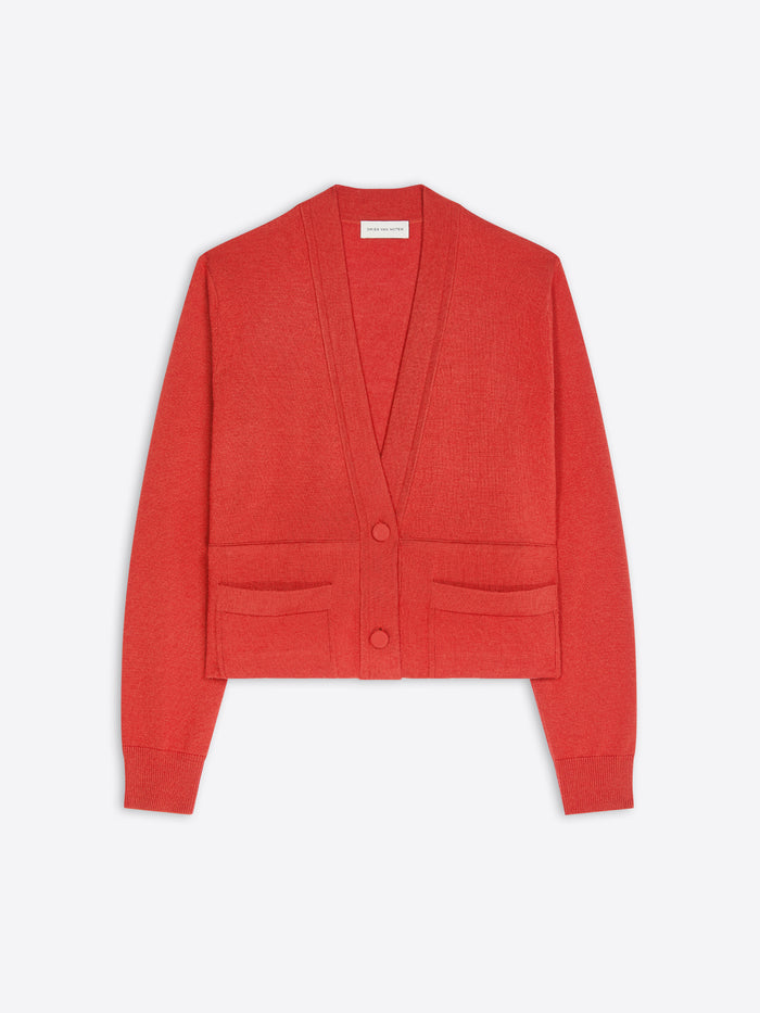 A cropped red cardigan sweater with a V-neck, two front buttons, and two front patch pockets, shown flat against a light gray background.