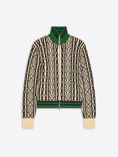 A cropped knit zip-up jacket featuring a cream and black geometric pattern, a solid green collar and hem, shown against a light gray background.