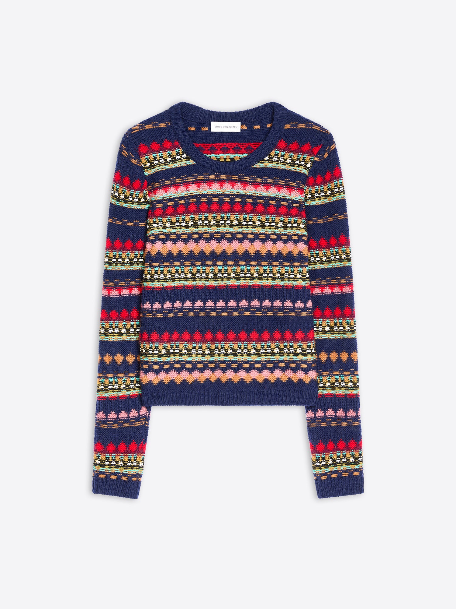 A cropped long-sleeve knit sweater with a multicolor pattern on a navy blue base, displayed flat against a light gray background.