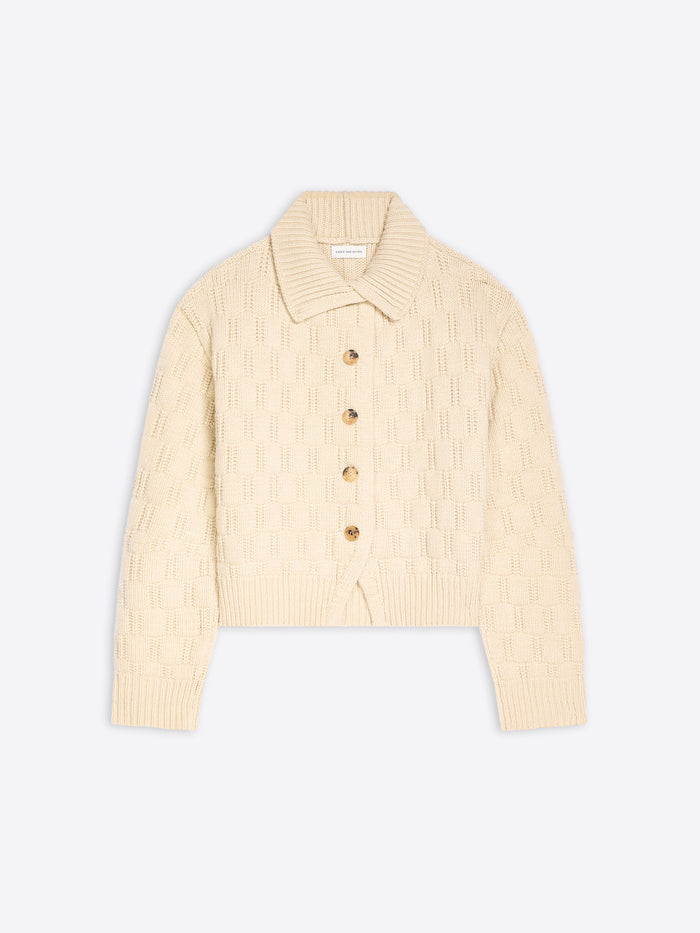 A cream-colored textured knit cardigan sweater with a collar and four buttons, displayed flat against a light gray background.