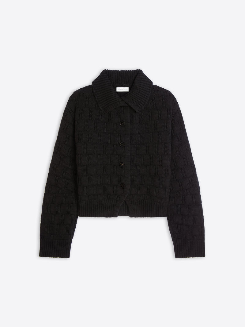 A black cropped knit cardigan with a textured basketweave pattern, a pointed collar, and a button-up front, displayed on a light gray background.