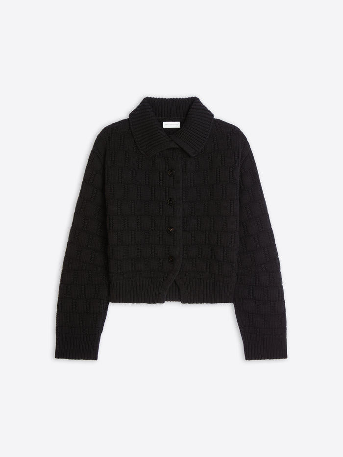 A black cropped knit cardigan with a textured basketweave pattern, a pointed collar, and a button-up front, displayed on a light gray background.