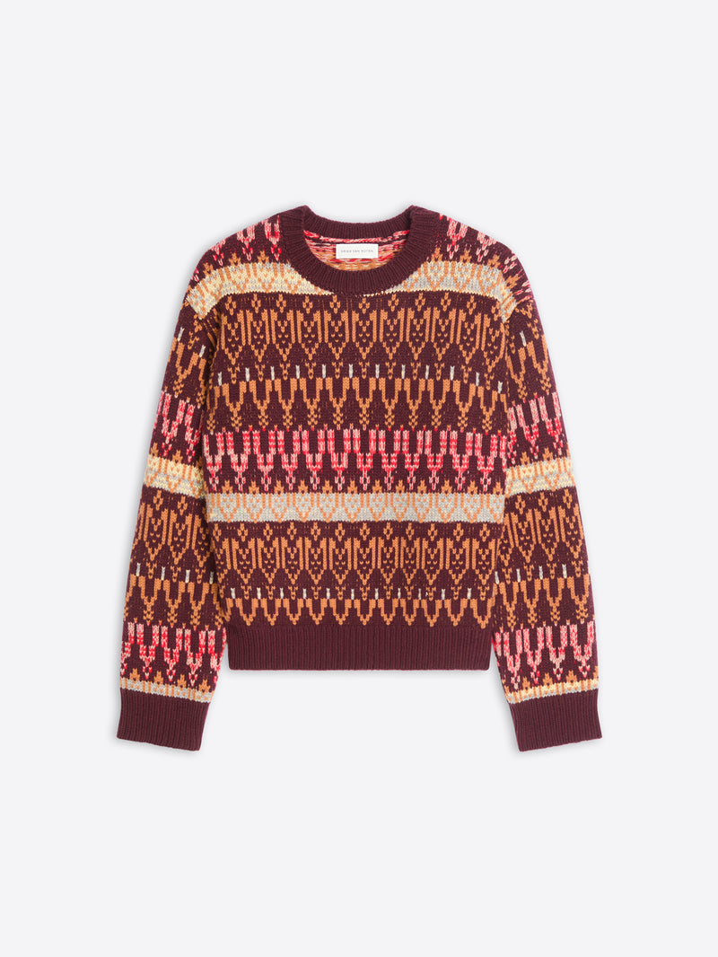 A long-sleeve crewneck knit sweater featuring a multicolor pattern displayed against a light gray background.