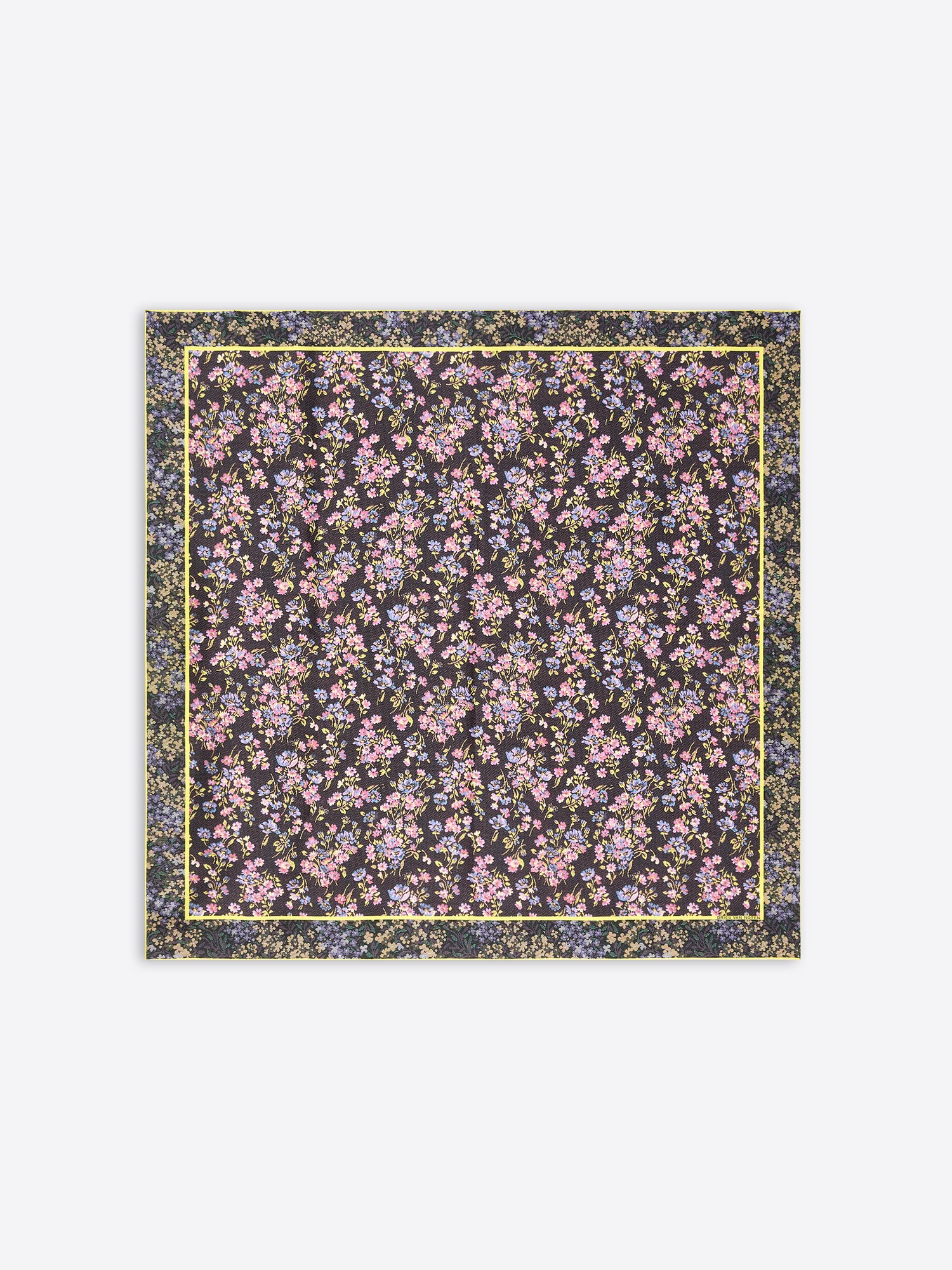 A square scarf featuring an all-over dense floral print  on a dark background, framed by a thin yellow border on a light gray background.