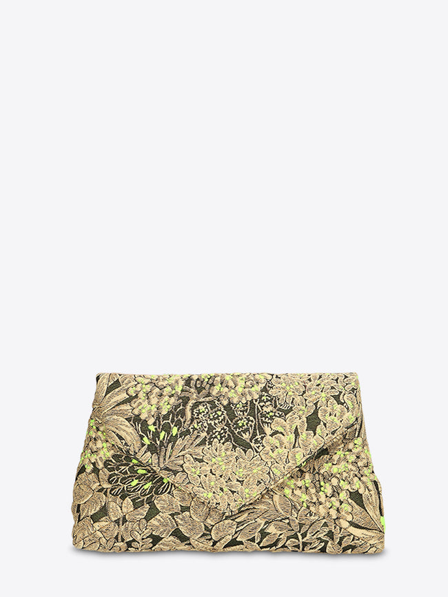 Fold-over clutch bag in black-and-gold floral jacquard with bright green accents on a light gray background.