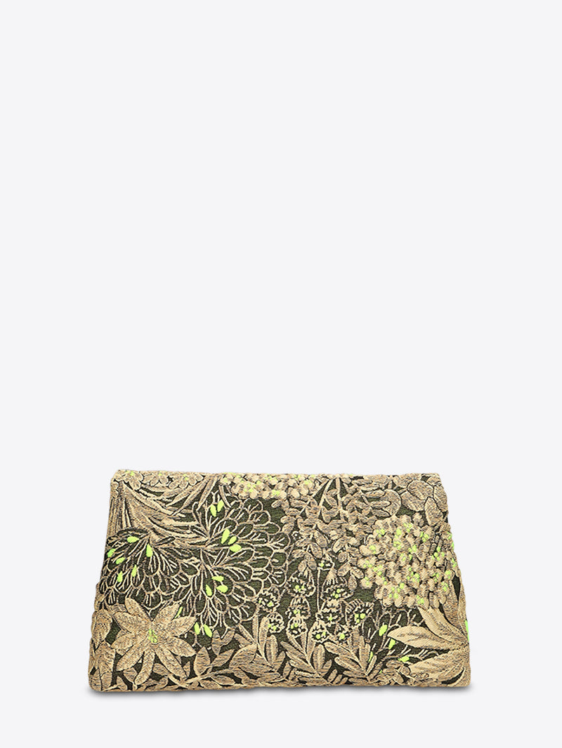 back view of a fold-over clutch bag in black-and-gold floral jacquard with bright green accents on a light gray background.