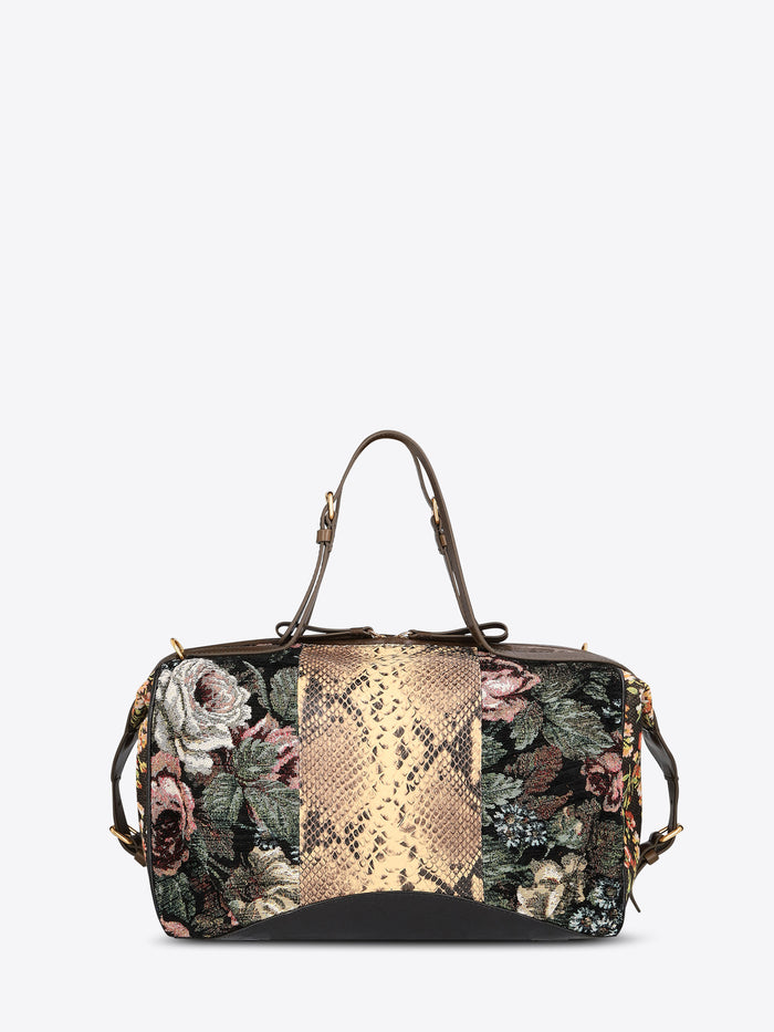 Structured floral jacquard duffle bag with a tan snakeskin-effect center panel, dark brown leather trim, and top handles on a light gray background.