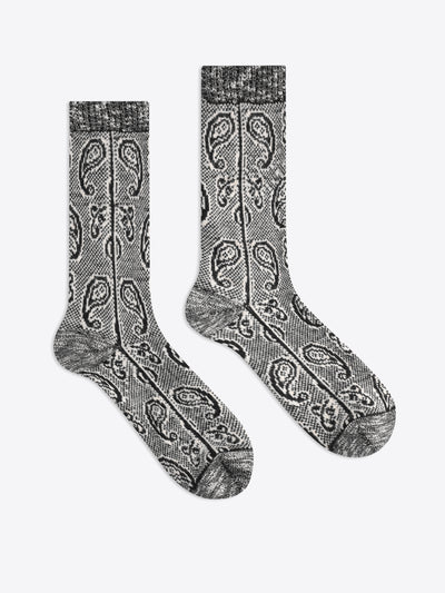 A pair of gray and black paisley patterned crew socks displayed flat against a light gray background.