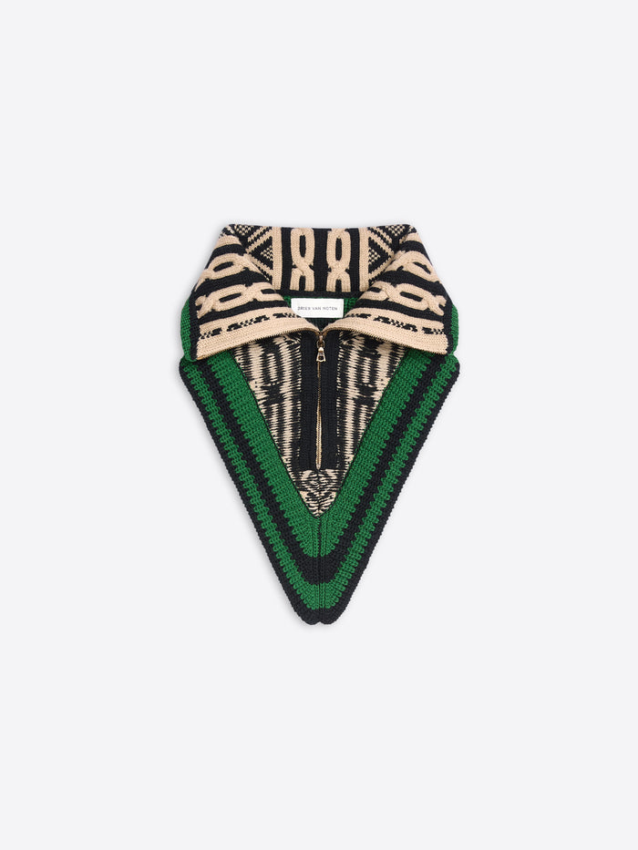 Black, cream, and green knitted neck warmer with a fold-over collar, zip front, and geometric pattern on a light gray background.