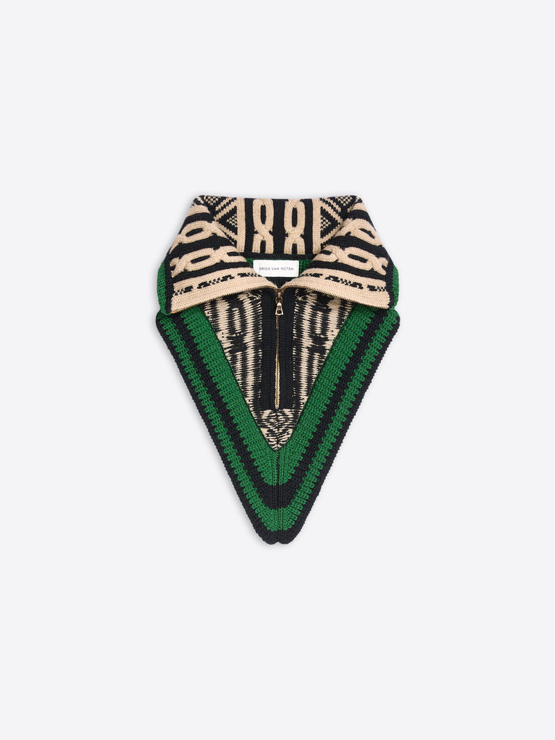 Black, cream, and green knitted neck warmer with a fold-over collar, zip front, and geometric pattern on a light gray background.