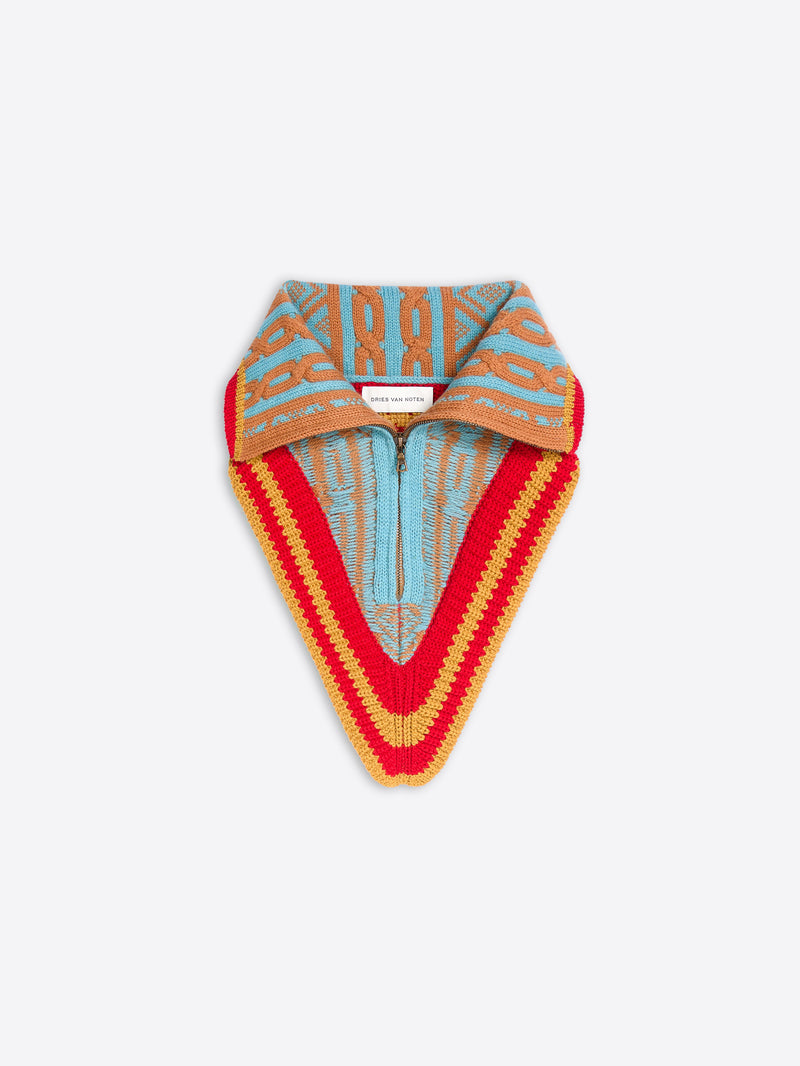 Multicolored knitted neck warmer with a fold-over collar, zip front, and red, mustard, aqua, and tan geometric pattern.