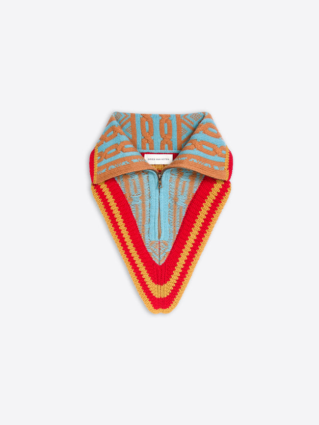 Multicolored knitted neck warmer with a fold-over collar, zip front, and red, mustard, aqua, and tan geometric pattern.