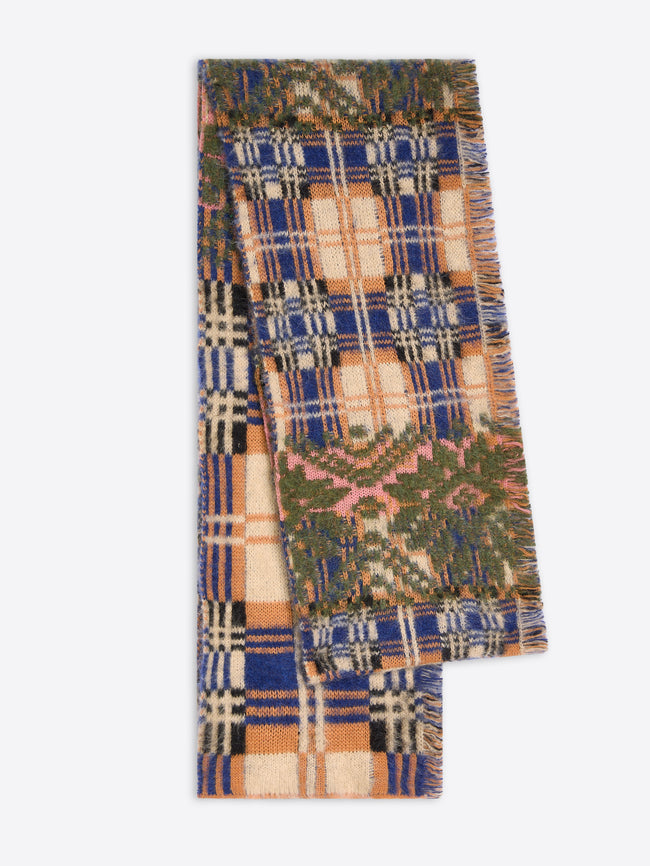 A folded woven scarf with a multicolor patchwork plaid pattern, featuring blue, beige, green, and pink sections with fringed edges, shown against a light gray background.