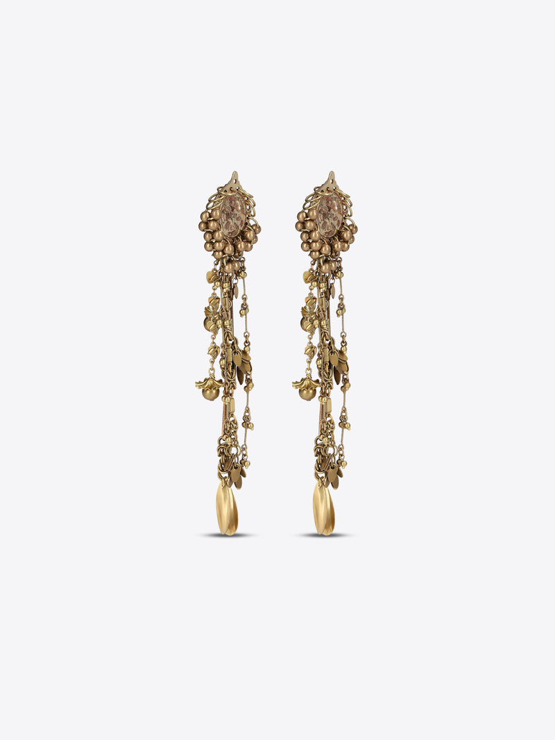 Pair of old brass drop earrings with oval medallions, cascading chains, floral charms, and teardrop pendants on a light gray background.