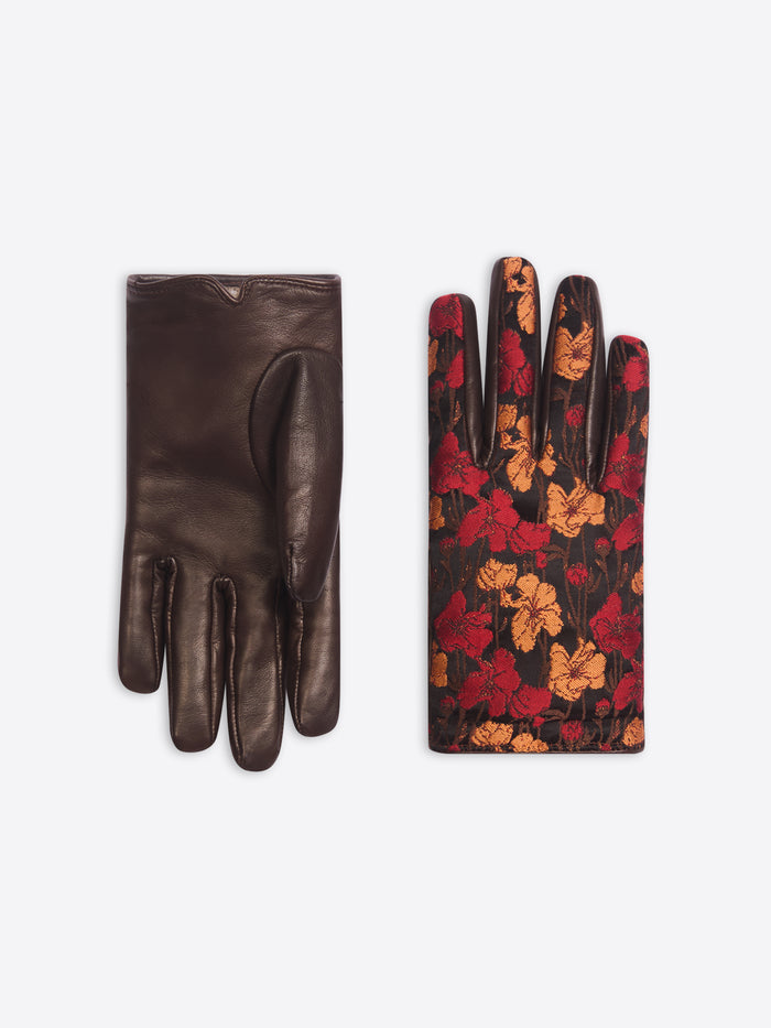 Brown leather glove with floral pattern on a white background
