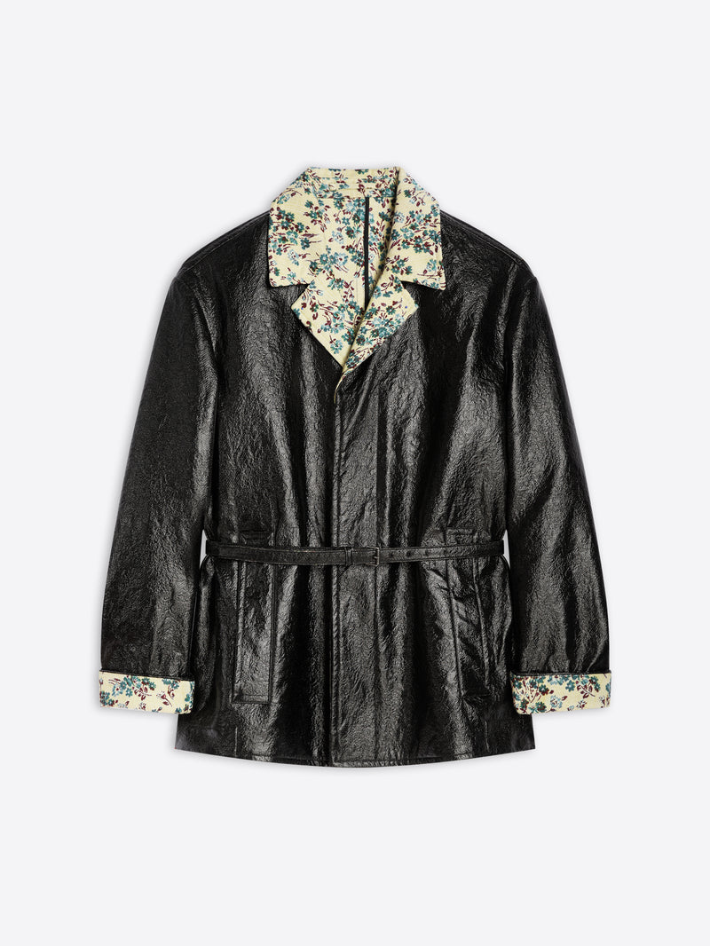 Black coat with floral hood and cuffs on a light gray background