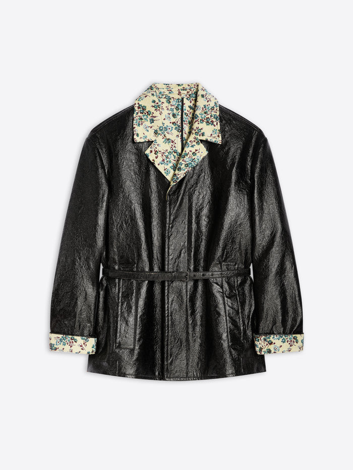 Black coat with floral hood and cuffs on a light gray background