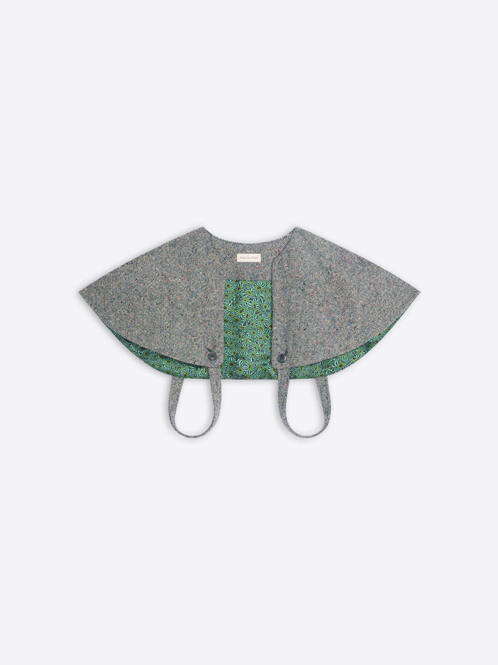Gray cape-style garment on a white background