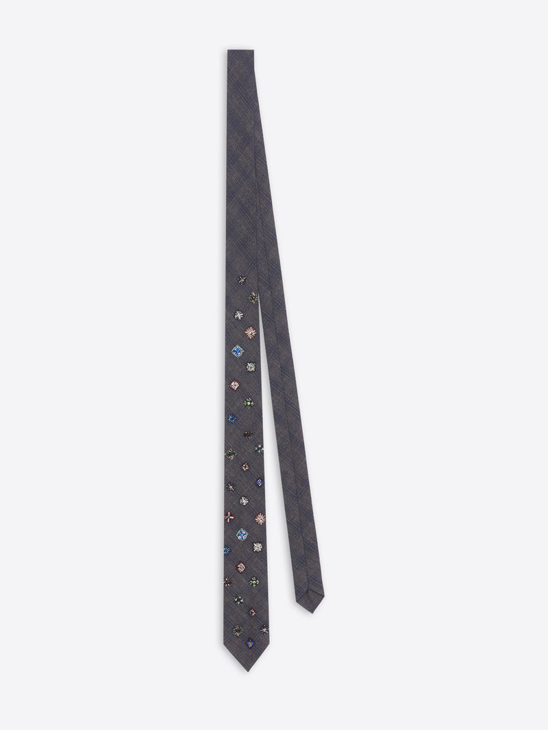 Navy blue floral patterned tie on a white background