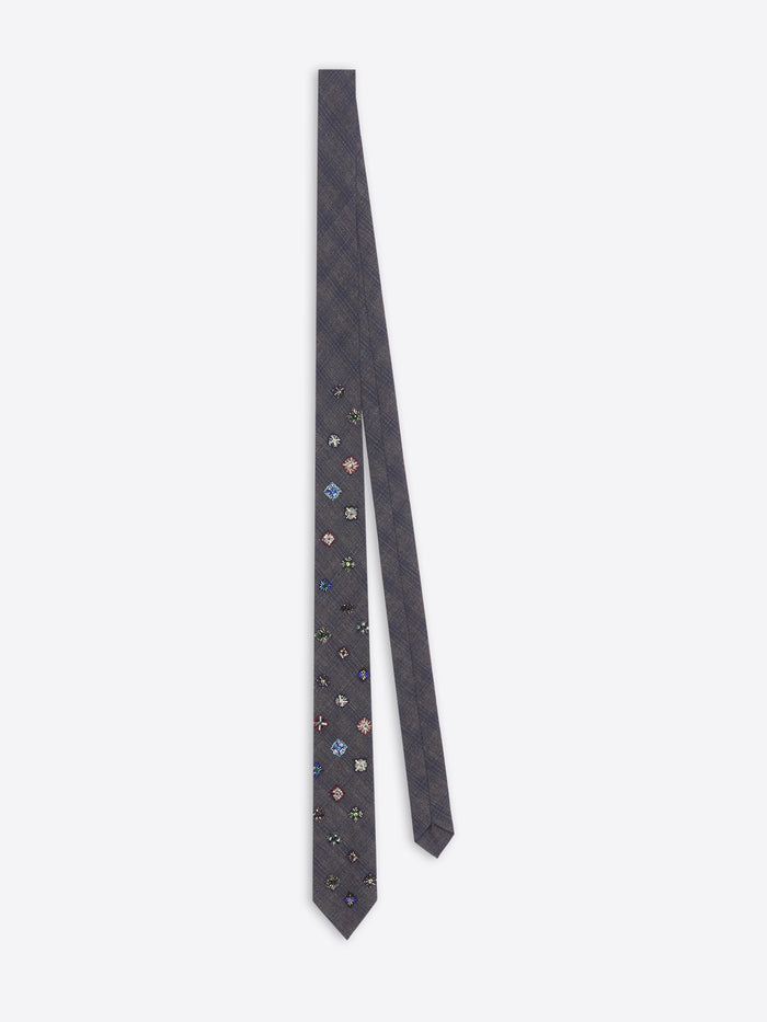 Navy blue floral patterned tie on a white background